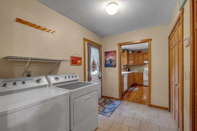3 Copperas Branch Rd, Leoma, TN 38468 - washroom with separate washer and dryer, a textured ceiling, and light tile patterned flooring
