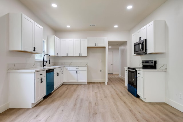 215 Kerr Ave, Murfreesboro, TN 37130 - kitchen with electric range oven, stainless steel microwave, dishwasher, light wood-style floors, and recessed lighting