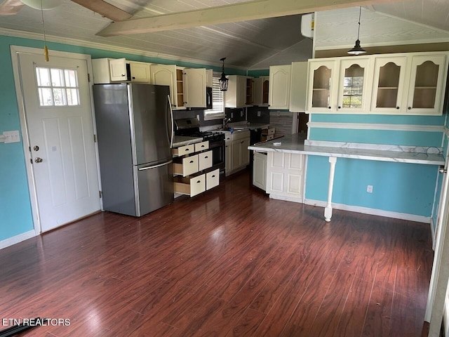 4516 Nashville Hwy, Deer Lodge, TN 37726 - kitchen with appliances with stainless steel finishes, vaulted ceiling, dark wood-style floors, glass insert cabinets, and decorative light fixtures