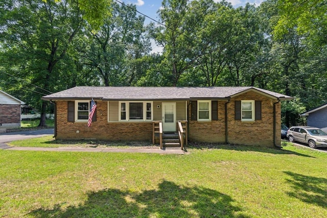 101 Burnett Rd, Dickson, TN 37055 - ranch-style home featuring brick siding, a front yard, and a porch