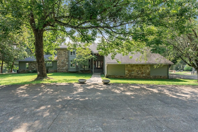 8530 Saundersville Rd, Mount Juliet, TN 37122 - view of front of home featuring stone siding, a front yard, and roof with shingles