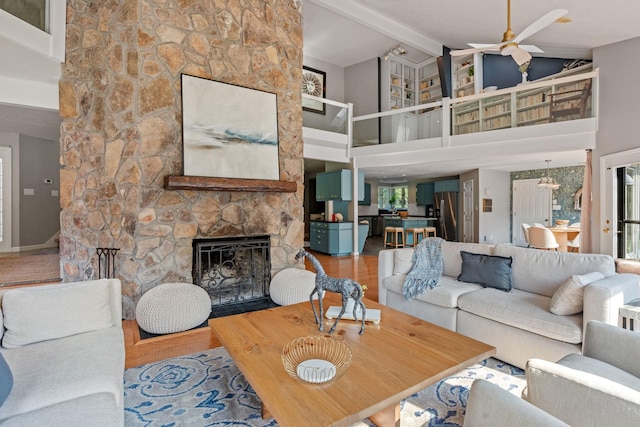 8530 Saundersville Rd, Mount Juliet, TN 37122 - living area with a fireplace, ceiling fan, high vaulted ceiling, beam ceiling, and wood finished floors