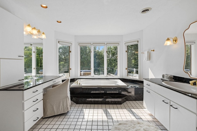 8530 Saundersville Rd, Mount Juliet, TN 37122 - bathroom featuring plenty of natural light, vanity, a bath, tile patterned flooring, and recessed lighting