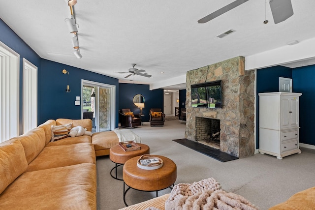 8530 Saundersville Rd, Mount Juliet, TN 37122 - carpeted living area with a ceiling fan and a fireplace
