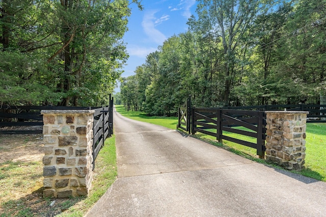 8530 Saundersville Rd, Mount Juliet, TN 37122 - view of concrete driveway featuring a gate