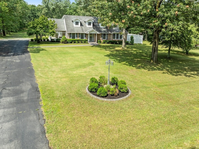 1746 Harton Blvd, Tullahoma, TN 37388 - cape cod home with a front yard, driveway, and roof with shingles