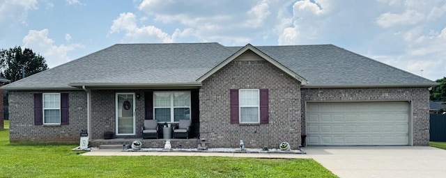 11013 Nevada Ave, Smyrna, TN 37167 - view of front facade featuring brick siding, driveway, a porch, an attached garage, and a front lawn