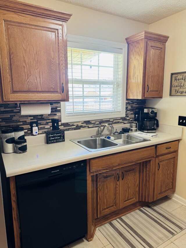 11013 Nevada Ave, Smyrna, TN 37167 - kitchen with dishwasher, tasteful backsplash, light countertops, brown cabinets, and light tile patterned floors