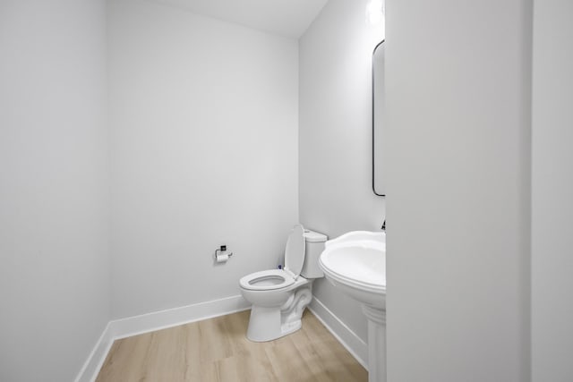 106 5th Ave N, Decherd, TN 37324 - half bathroom featuring wood finished floors and baseboards