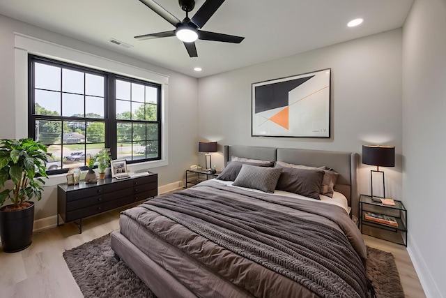 106 5th Ave N, Decherd, TN 37324 - bedroom with light wood-type flooring, a ceiling fan, and recessed lighting