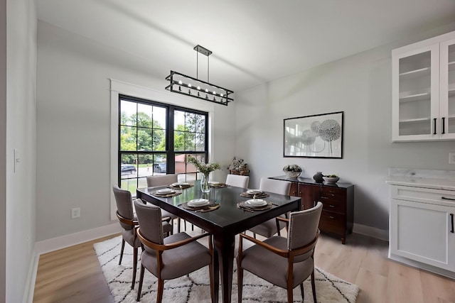 106 5th Ave N, Decherd, TN 37324 - dining area with light wood-style flooring and baseboards