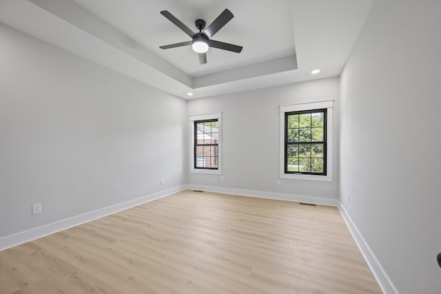 106 5th Ave N, Decherd, TN 37324 - unfurnished room with light wood finished floors, a ceiling fan, recessed lighting, and a raised ceiling