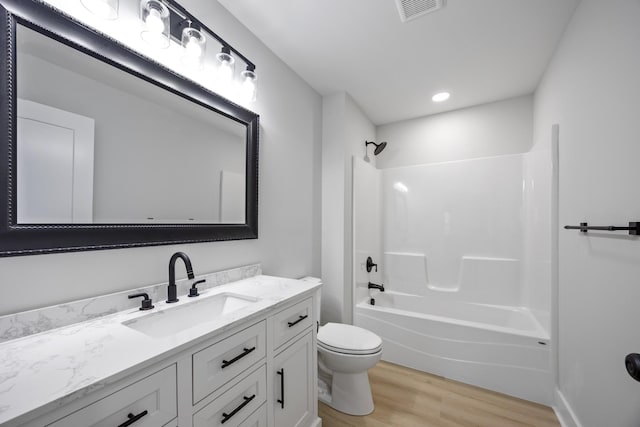 106 5th Ave N, Decherd, TN 37324 - bathroom with wood finished floors, vanity, and tub / shower combination
