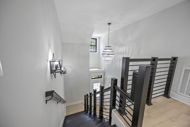 106 5th Ave N, Decherd, TN 37324 - stairs with a chandelier and baseboards