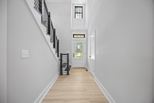 106 5th Ave N, Decherd, TN 37324 - entrance foyer with stairway, light wood-style floors, and a towering ceiling