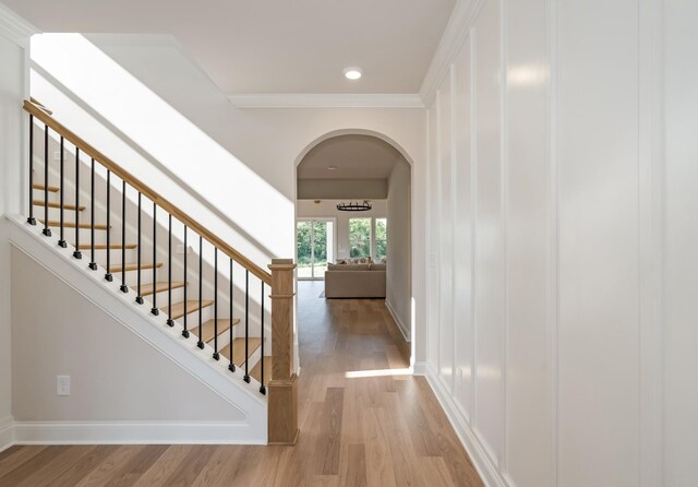 204 Phillips Bnd, Spring Hill, TN 37174 - stairs with arched walkways, wood finished floors, ornamental molding, and recessed lighting