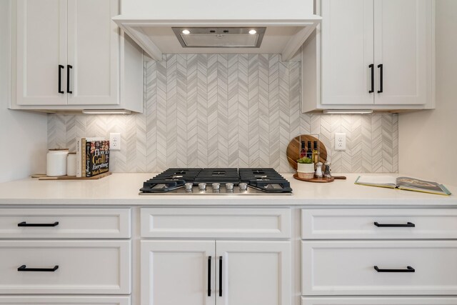 204 Phillips Bnd, Spring Hill, TN 37174 - kitchen featuring light countertops, white cabinets, decorative backsplash, and stainless steel gas cooktop