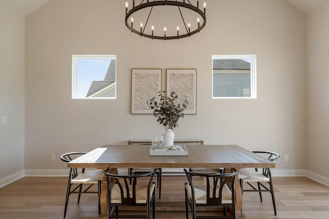 204 Phillips Bnd, Spring Hill, TN 37174 - dining area with light wood-style floors, a chandelier, and lofted ceiling