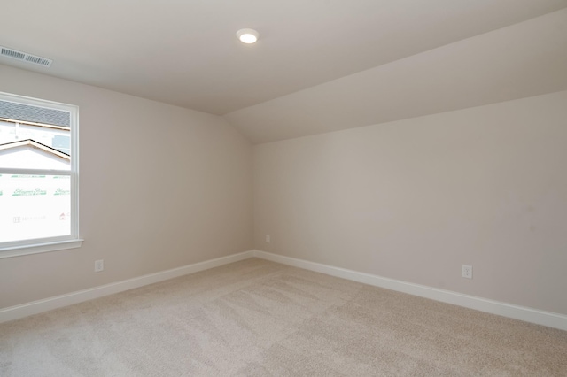 204 Phillips Bnd, Spring Hill, TN 37174 - additional living space with light colored carpet and vaulted ceiling