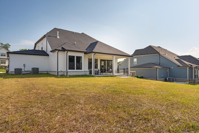 204 Phillips Bnd, Spring Hill, TN 37174 - back of house featuring a yard, a patio area, and a shingled roof