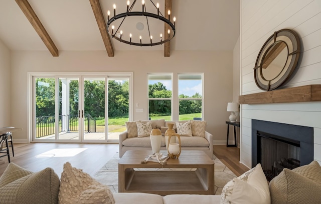 204 Phillips Bnd, Spring Hill, TN 37174 - living area featuring light wood-style flooring, a chandelier, healthy amount of natural light, and a fireplace