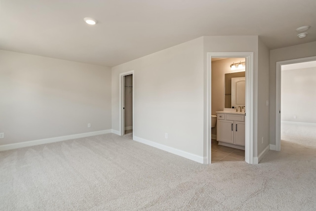 204 Phillips Bnd, Spring Hill, TN 37174 - unfurnished bedroom featuring light colored carpet, ensuite bath, and a walk in closet