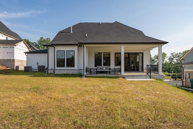 204 Phillips Bnd, Spring Hill, TN 37174 - back of house featuring a yard, roof with shingles, and brick siding