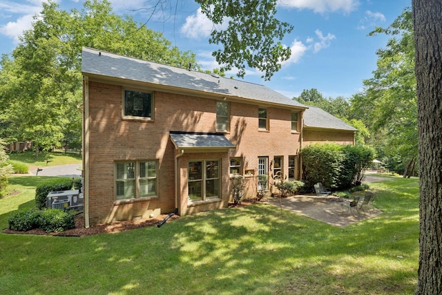712 Roxburgh Cv, Brentwood, TN 37027 - back of property with a patio, a lawn, and brick siding