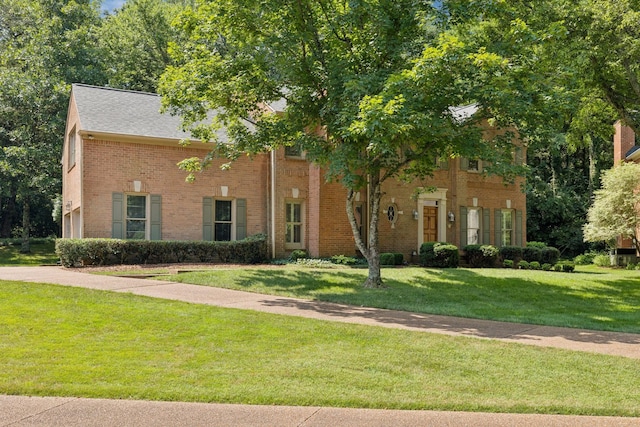 712 Roxburgh Cv, Brentwood, TN 37027 - view of front of home with a front yard, brick siding, and roof with shingles