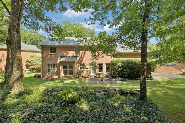 712 Roxburgh Cv, Brentwood, TN 37027 - rear view of house featuring a lawn and an outdoor fire pit