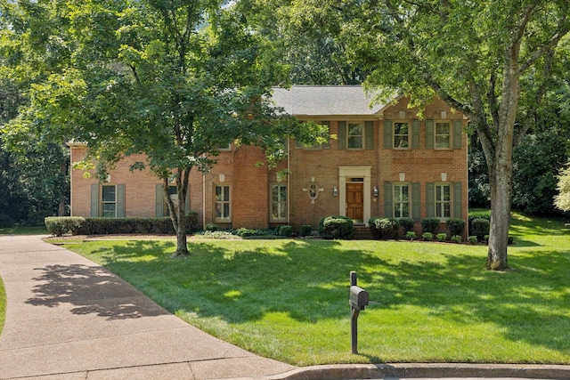 712 Roxburgh Cv, Brentwood, TN 37027 - colonial inspired home featuring brick siding and a front yard
