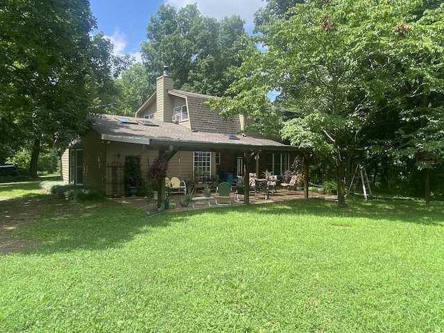 3240 Valley View Ct, Goodlettsville, TN 37072 - rear view of property featuring a patio, a chimney, a lawn, and a shingled roof