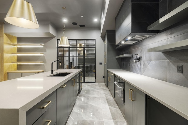 1884 Barnstaple Ln, Brentwood, TN 37027 - kitchen with open shelves, light countertops, wall chimney exhaust hood, light marble finish flooring, and a center island with sink