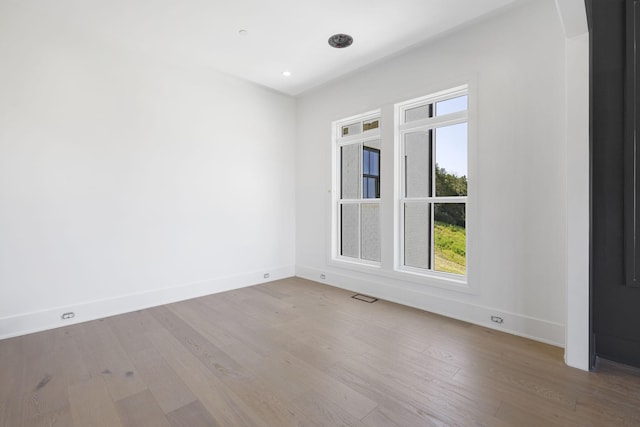 1884 Barnstaple Ln, Brentwood, TN 37027 - unfurnished room with wood finished floors, arched walkways, and recessed lighting