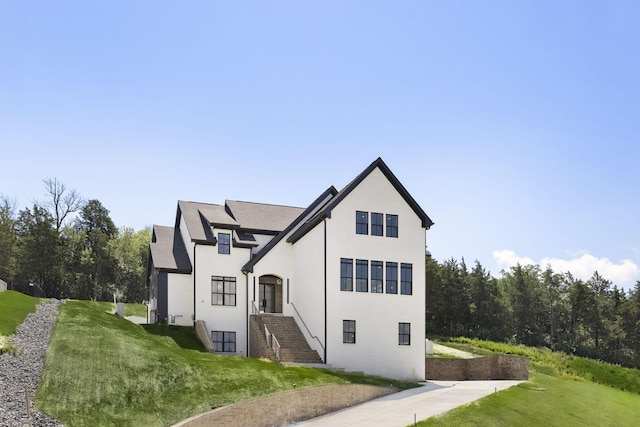 1884 Barnstaple Ln, Brentwood, TN 37027 - view of side of property with a lawn and stucco siding