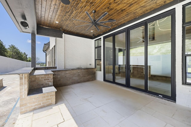 1884 Barnstaple Ln, Brentwood, TN 37027 - view of patio / terrace featuring a ceiling fan, exterior kitchen, and a bar