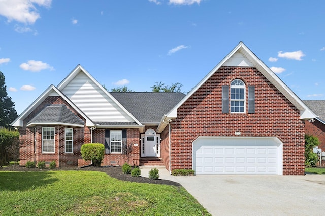370 Calumet Trce, Murfreesboro, TN 37127 - traditional-style house featuring driveway, brick siding, a front yard, an attached garage, and roof with shingles