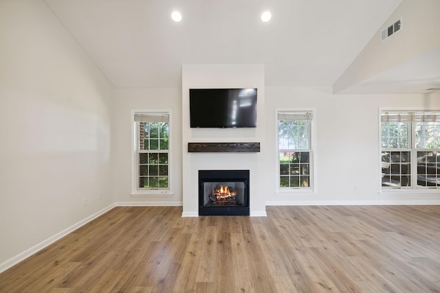 370 Calumet Trce, Murfreesboro, TN 37127 - unfurnished living room featuring a lit fireplace, wood finished floors, plenty of natural light, recessed lighting, and vaulted ceiling