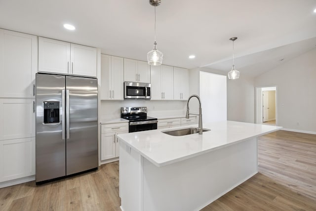 370 Calumet Trce, Murfreesboro, TN 37127 - kitchen with stainless steel appliances, light wood-type flooring, white cabinetry, decorative light fixtures, and a kitchen island with sink