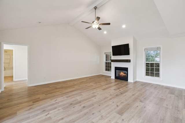 370 Calumet Trce, Murfreesboro, TN 37127 - unfurnished living room with a glass covered fireplace, ceiling fan, beamed ceiling, light wood-type flooring, and high vaulted ceiling