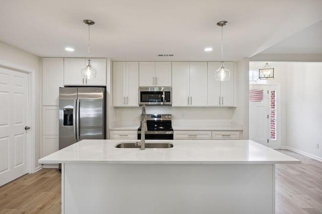 370 Calumet Trce, Murfreesboro, TN 37127 - kitchen featuring appliances with stainless steel finishes, light wood-style flooring, white cabinets, hanging light fixtures, and recessed lighting