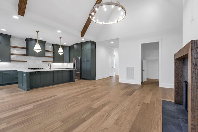 3244 Arundel Ln, Thompsons Station, TN 37179 - kitchen featuring open shelves, high end refrigerator, light countertops, light wood-style flooring, and backsplash