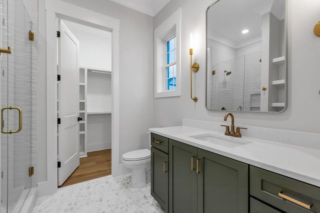 3244 Arundel Ln, Thompsons Station, TN 37179 - full bath featuring a stall shower, vanity, a walk in closet, wood finished floors, and recessed lighting