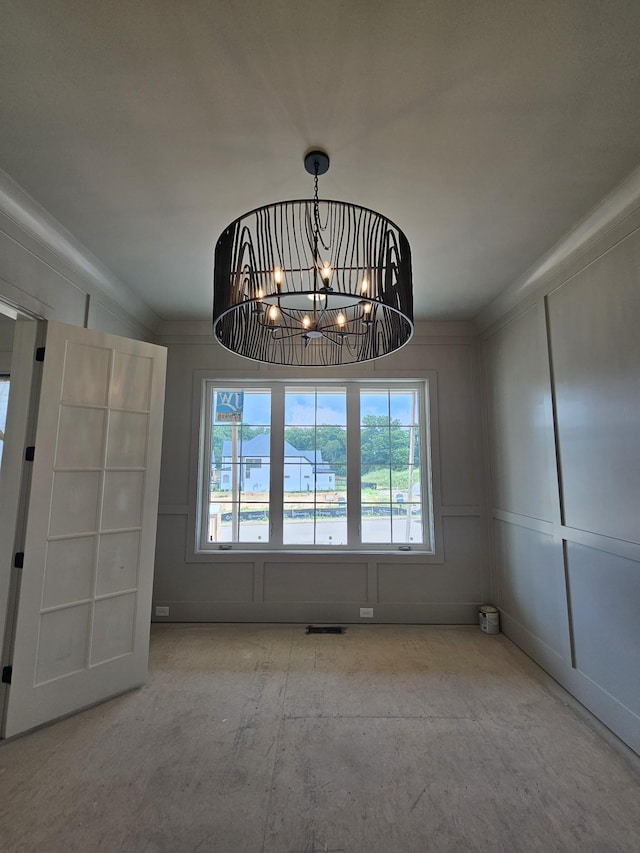 3244 Arundel Ln, Thompsons Station, TN 37179 - unfurnished dining area featuring a chandelier and a decorative wall