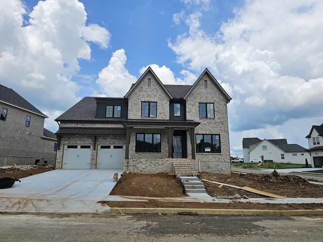 3244 Arundel Ln, Thompsons Station, TN 37179 - view of front facade with driveway, brick siding, and an attached garage