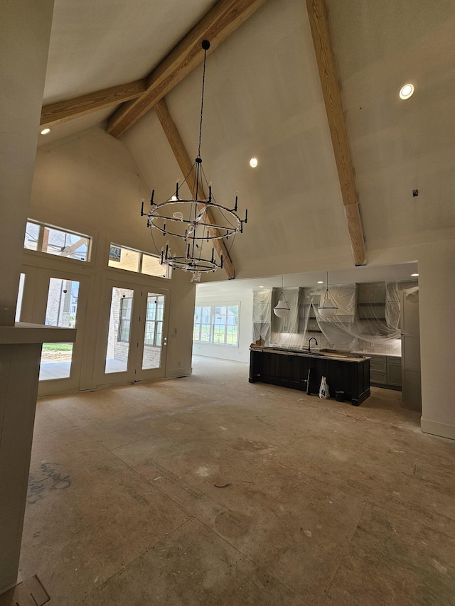 3244 Arundel Ln, Thompsons Station, TN 37179 - unfurnished living room featuring high vaulted ceiling, beam ceiling, a chandelier, recessed lighting, and french doors