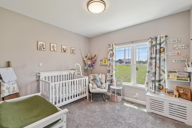 1219 Oak Grove Rd, Dickson, TN 37055 - carpeted bedroom featuring a nursery area and baseboards