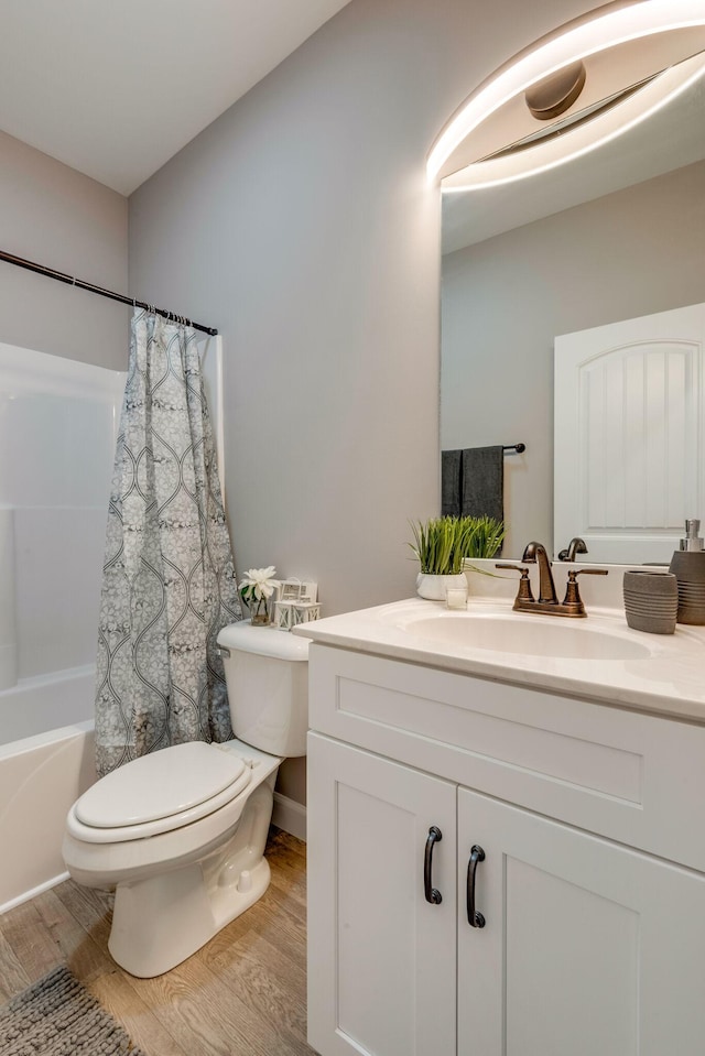 1219 Oak Grove Rd, Dickson, TN 37055 - bathroom featuring wood finished floors, vanity, and shower / tub combo