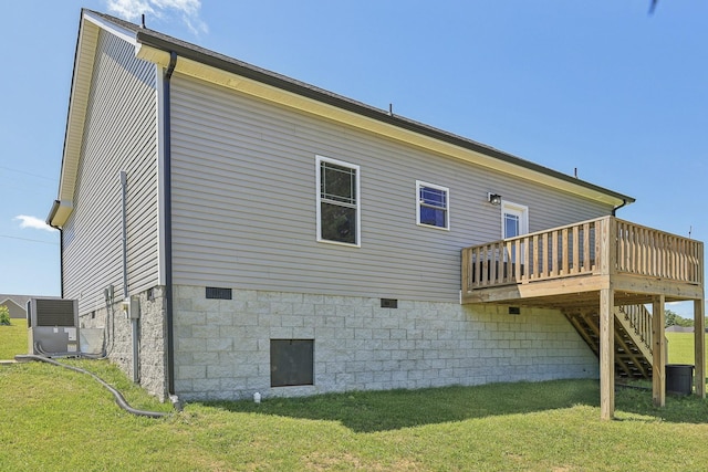 1219 Oak Grove Rd, Dickson, TN 37055 - rear view of house featuring a wooden deck, stairway, crawl space, and a yard