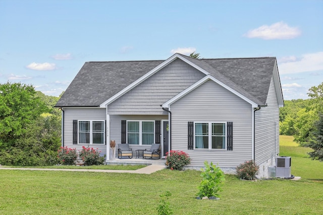 1219 Oak Grove Rd, Dickson, TN 37055 - view of front of home featuring a front yard, roof with shingles, and a patio area